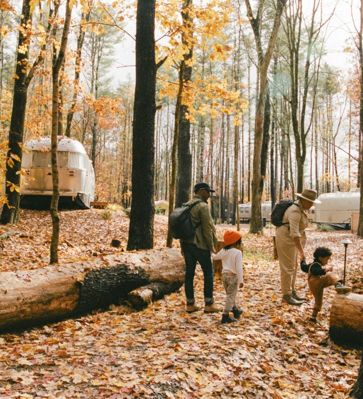 AutoCamp Catskills family in fall. Looking at changing leaves on property
