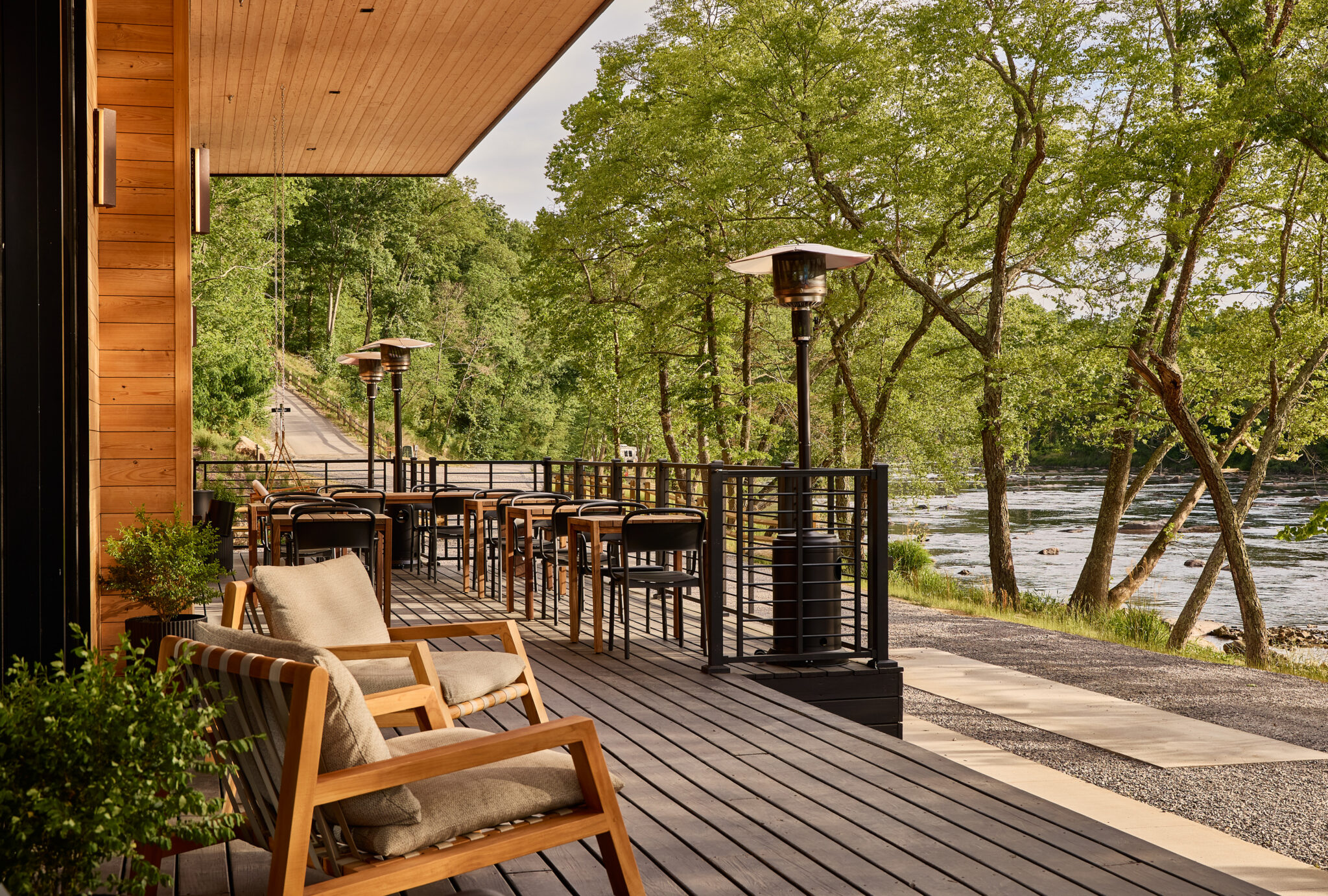 AutoCamp Asheville clubhouse deck by the river