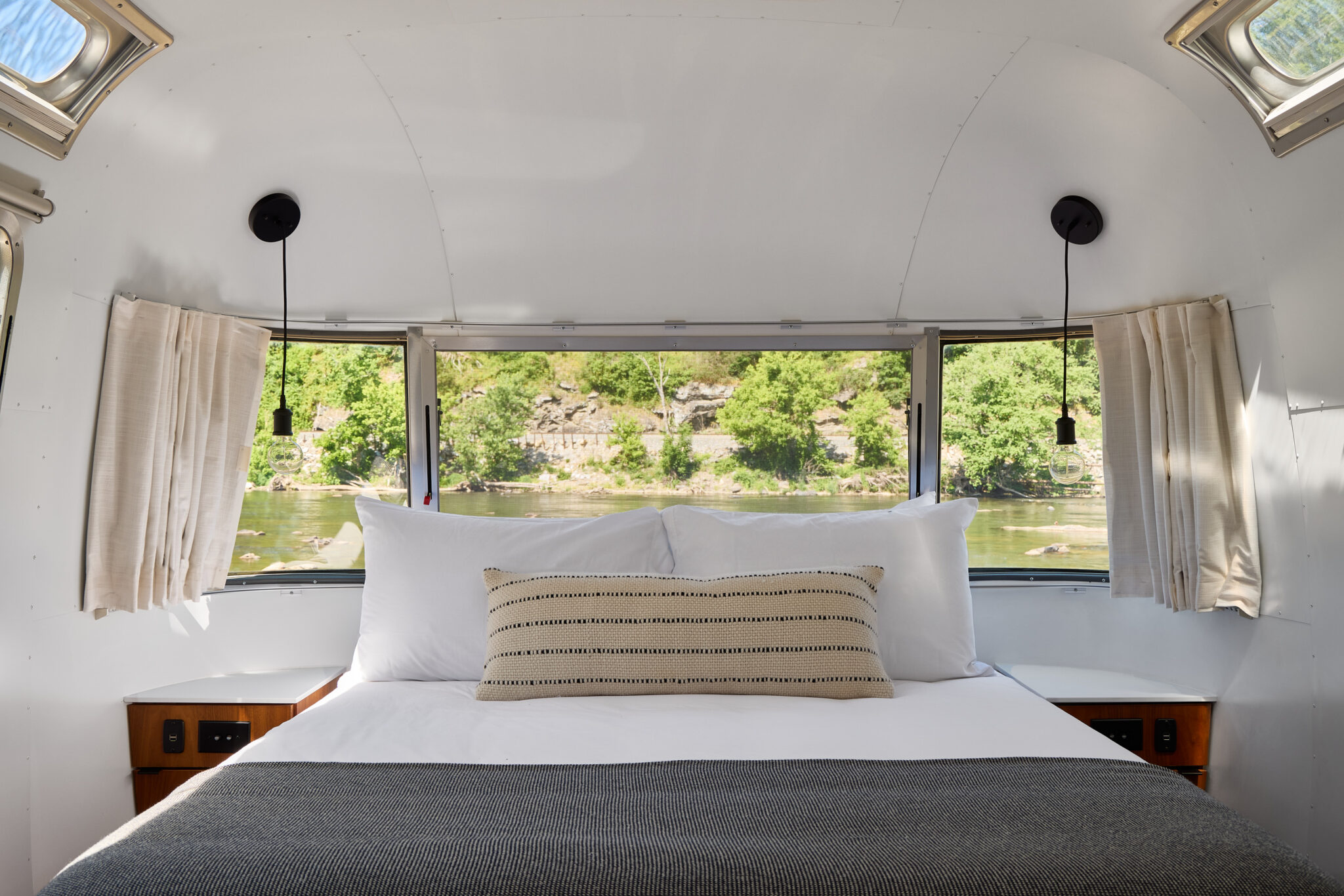 Autocamp asheville vista riverfront airstream view of river from bedroom window