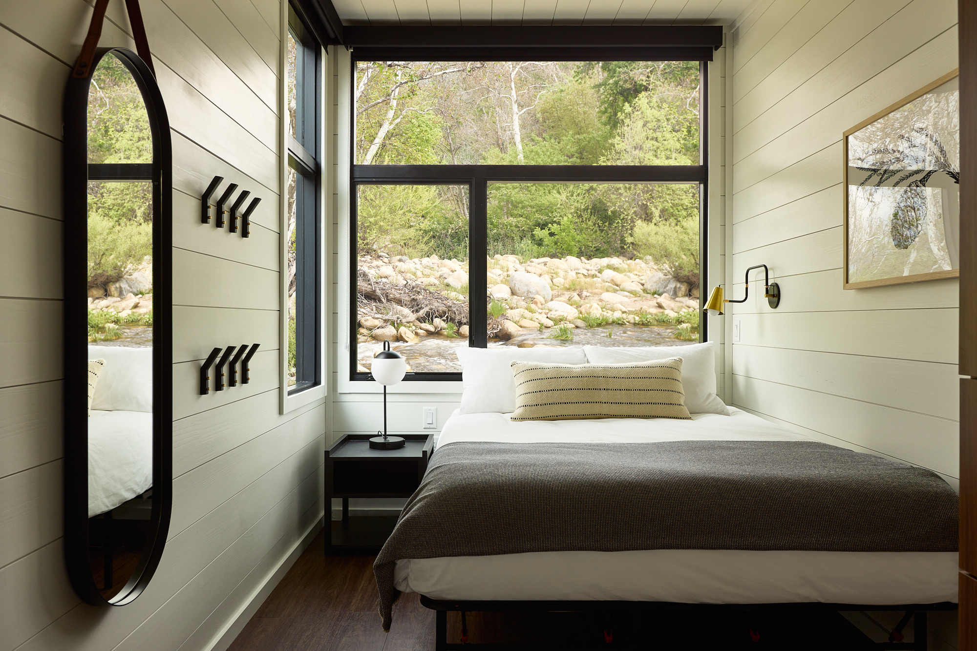 AutoCamp Sequoia Vista cabin suite bedroom view with river outside window