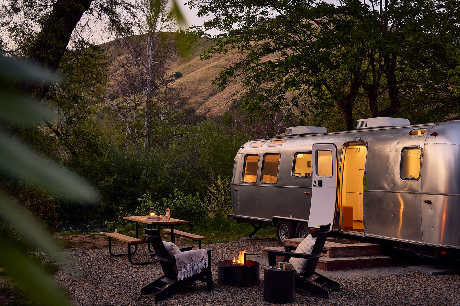 AutoCamp Sequoia Airstream at dusk next to the river