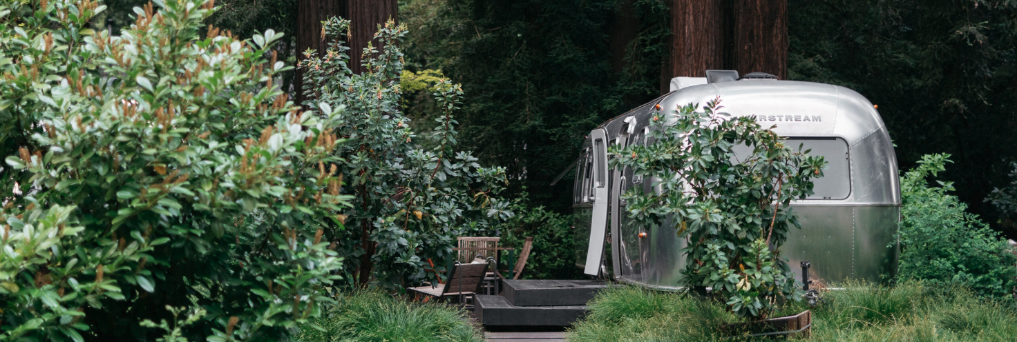 AutoCamp Sonoma Airstream suite exterior view through the trees