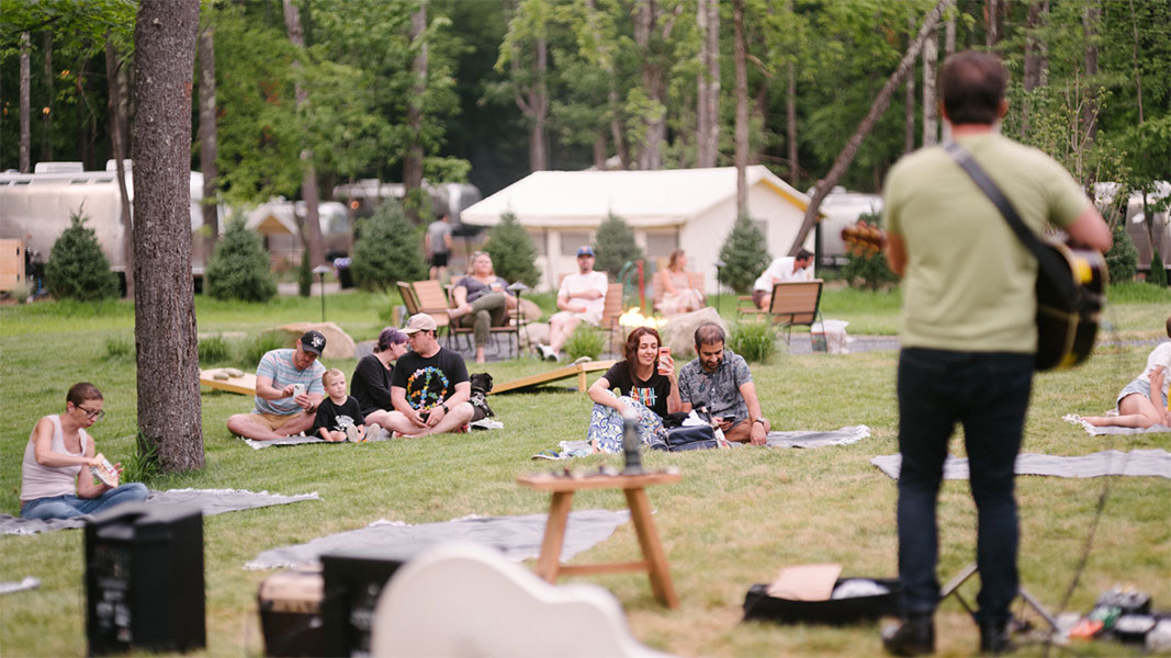 outdoor concert with guitar playing singer
