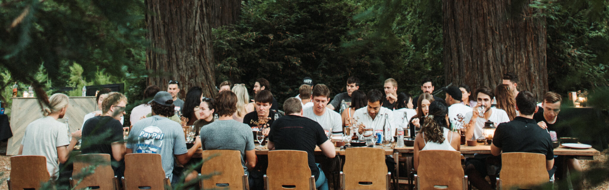 People sitting at outdoor table.