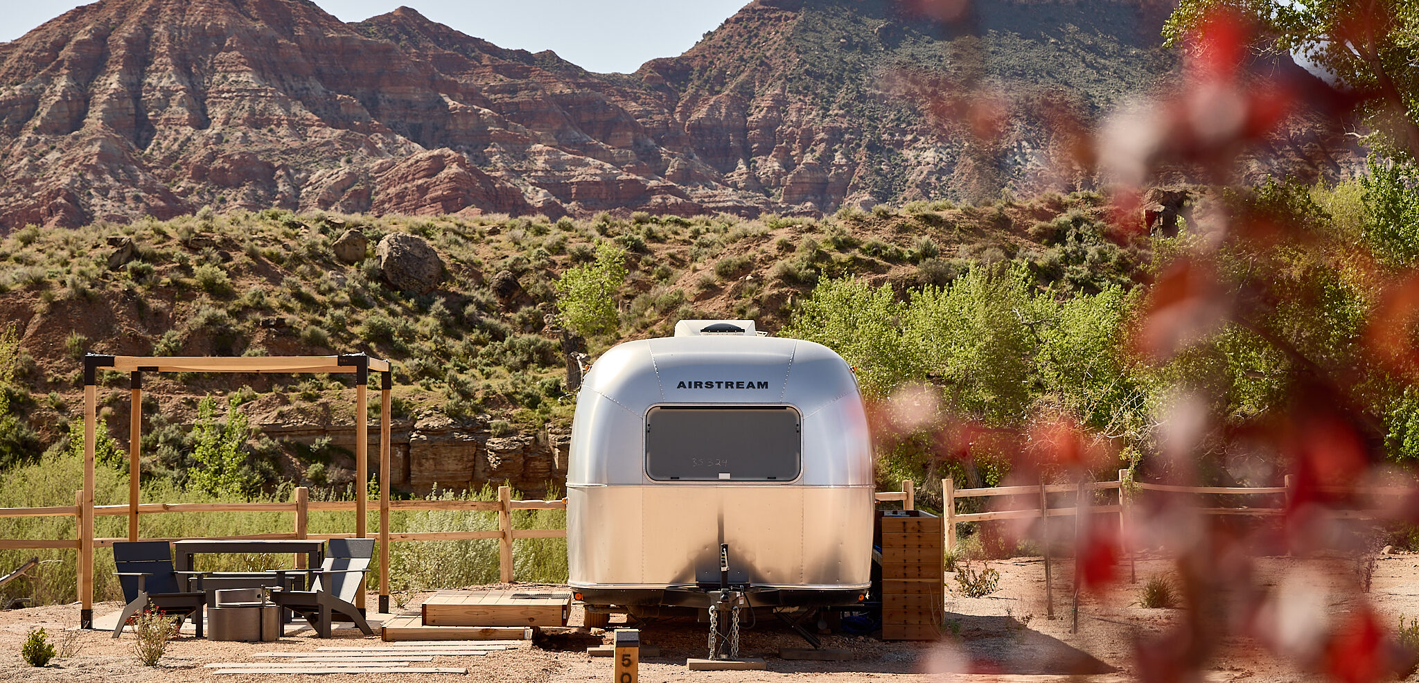 Airstream with Red Rocks in the background