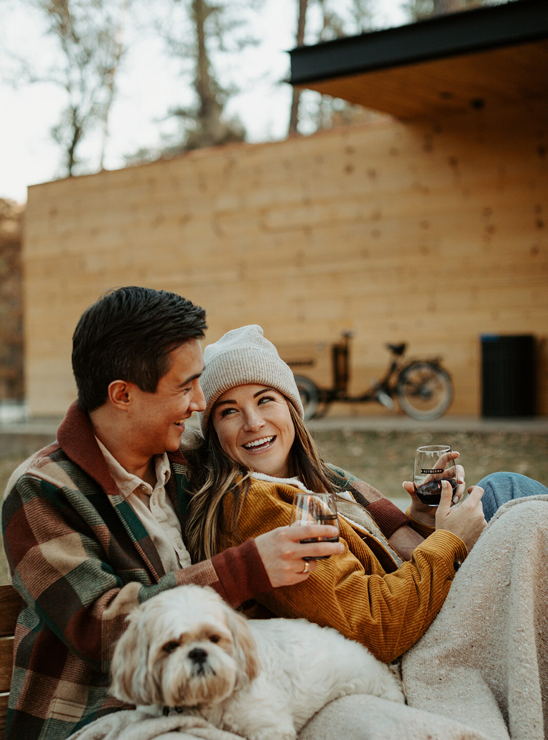 Man and woman drinking wine outside