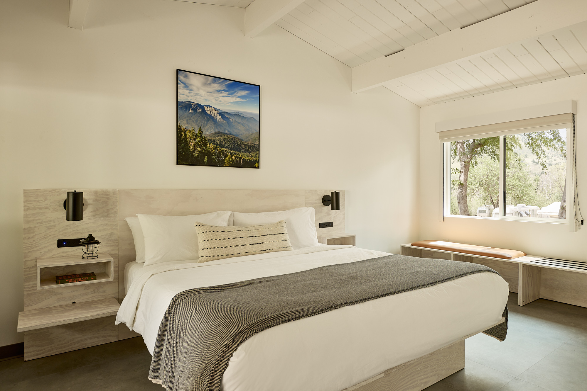 AutoCamp Sequoia queen bunk room view of bed