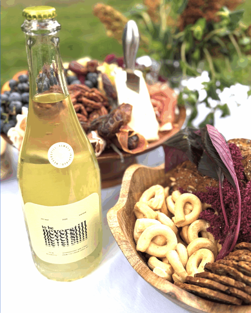 Neverstill Wine bottle and bowls of salty snacks for a tasting