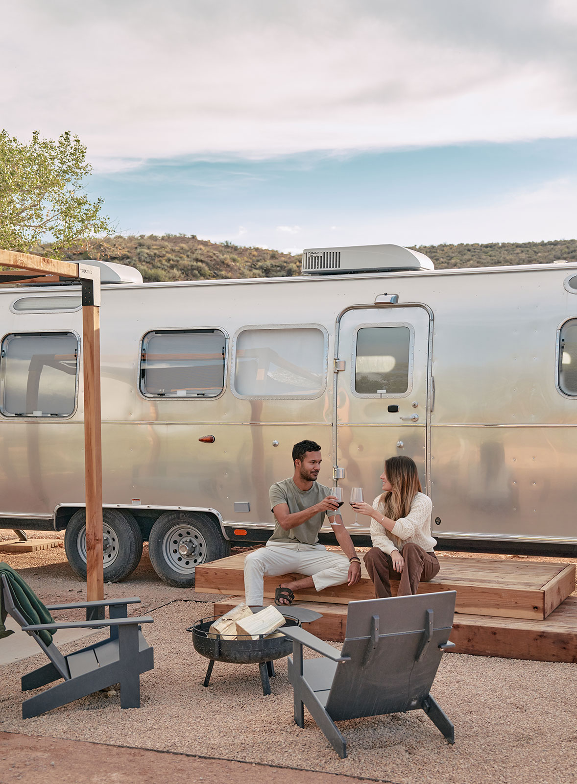 Couple drinking wine at camp