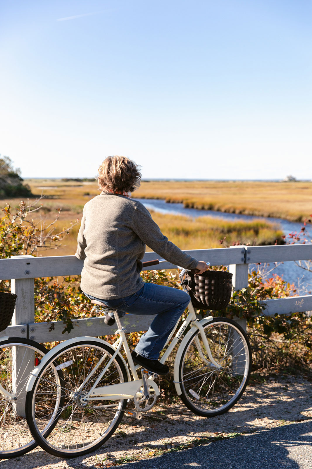 Woman biking near the shore