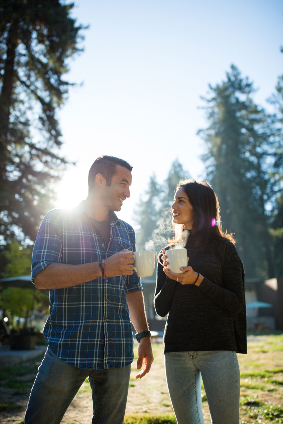 Couple sharing coffee outside