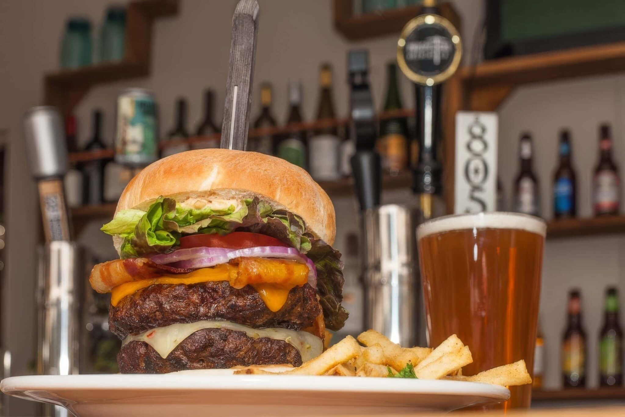 a burger and a beer from 1850 restaurant and brewery