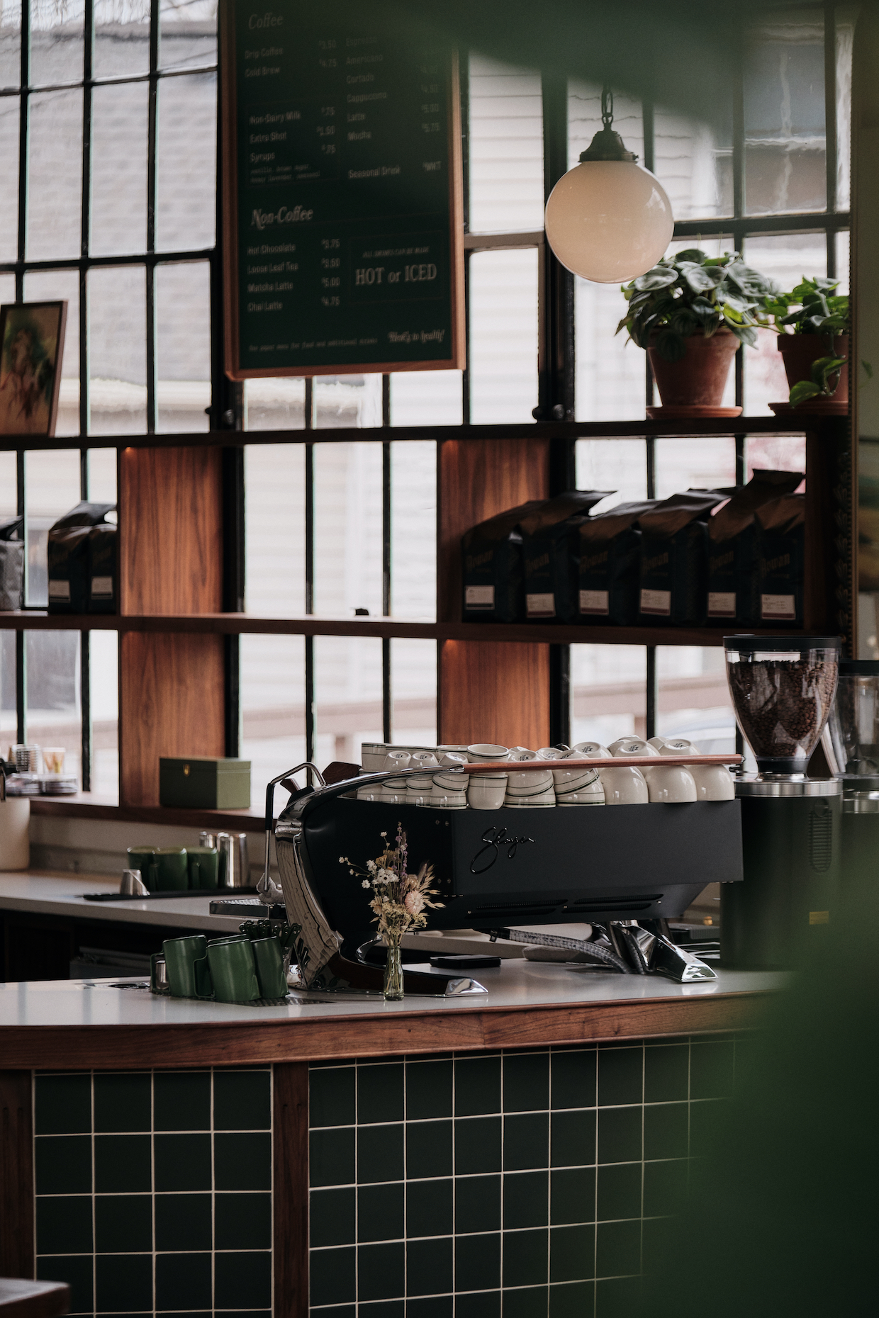 Cafe countertop with espresso machine and mugs