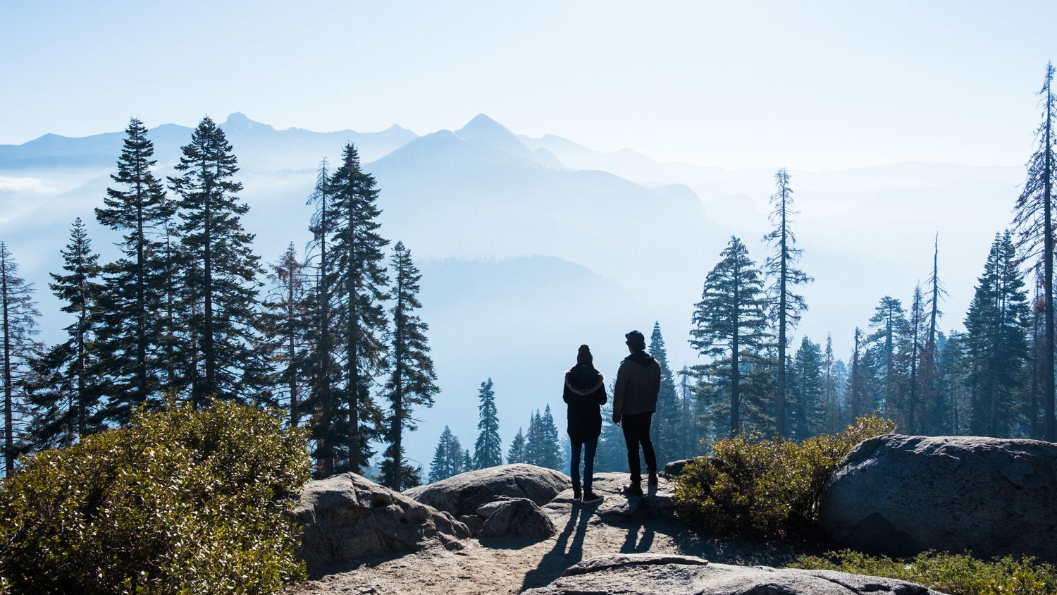 Couple looking over Yosemite views