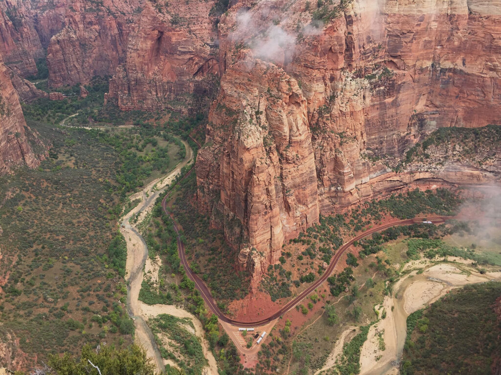 View of Zion red mountains and road below