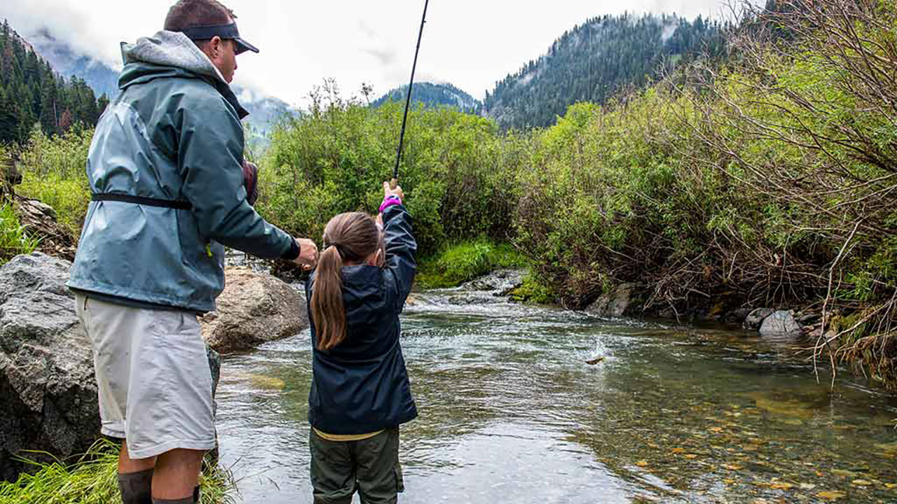 Girl fly fishing