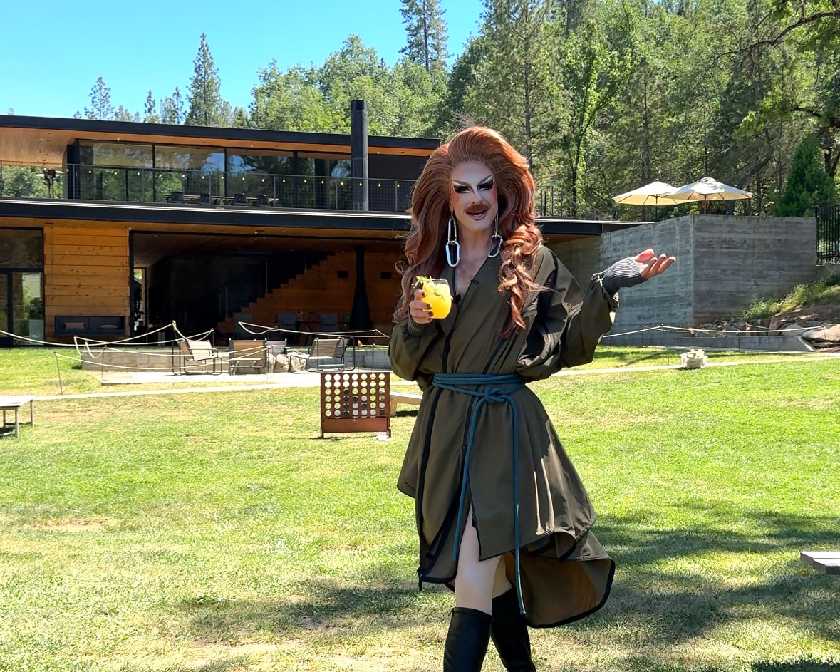 Patti Gonia pride outside with AutoCamp with a cocktail